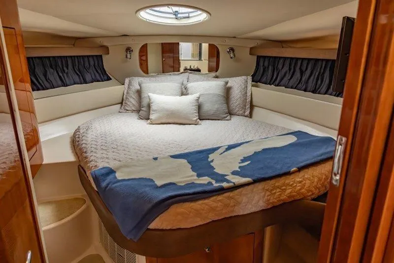 Slide: The Image of Luxurious cabin interior of 2008 Regal Commodore 3860 yacht with cozy bedding. - 6