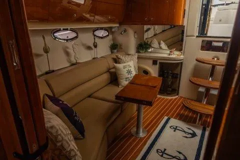 Slide: The Image of Luxurious interior of 2008 Regal Commodore 3860 yacht with cozy seating and nautical decor. - 7