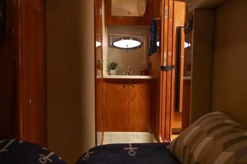 Slide: The Image of Interior of 2008 Regal Commodore 3860 yacht with cozy cabin and wooden finishes. - 9