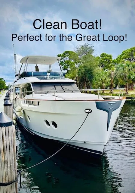 Slide: The Image of 2022 Greenline 48 Flybridge yacht docked, ideal for the Great Loop adventure. - 1
