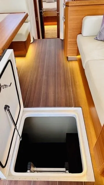 Slide: The Image of Interior of 2022 Greenline 48 Flybridge yacht, open hatch on wooden floor. - 33