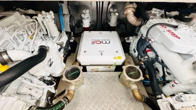Slide: The Image of Engine room of 2022 Greenline 48 Flybridge with Hardtop, featuring advanced machinery and components. - 35