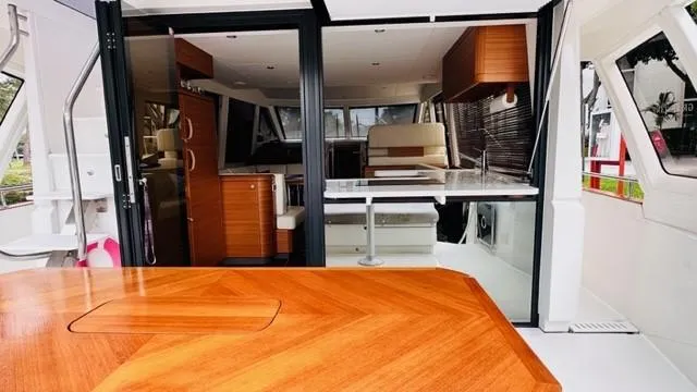 Slide: The Image of Luxurious 2022 Greenline 48 Flybridge yacht interior with elegant wood finishes and modern design. - 9
