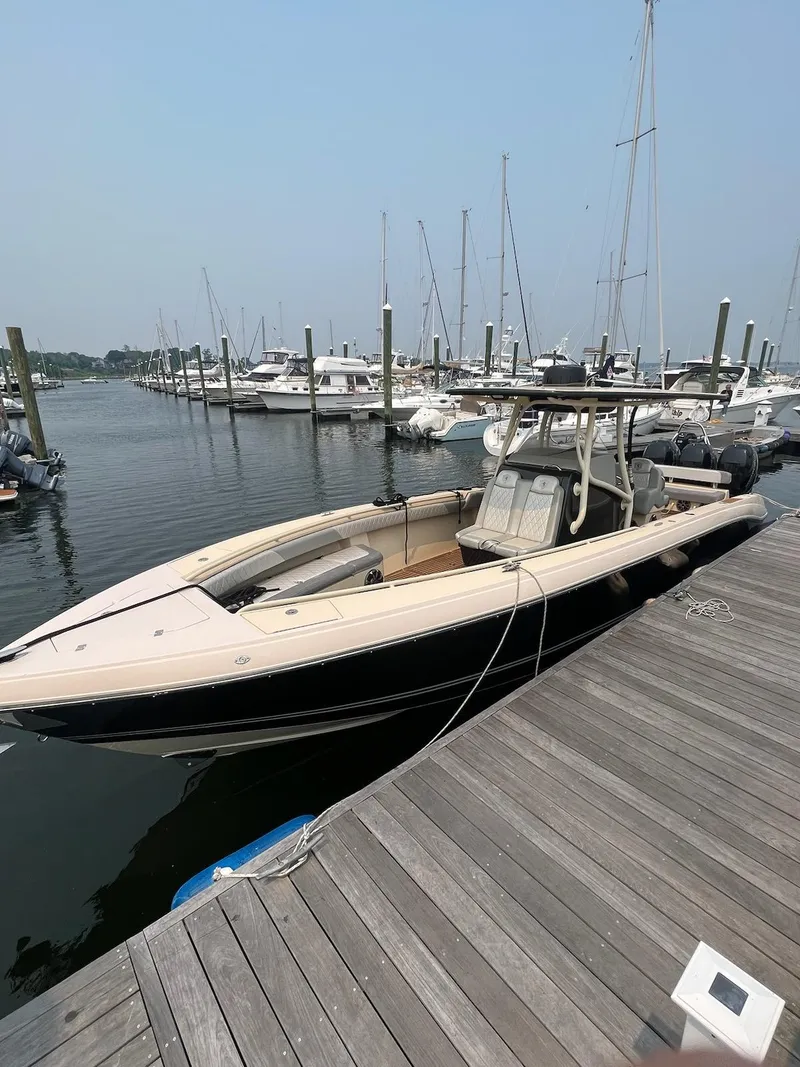 Slide: The Image of 2013 Statement 38 SUV Open boat docked at a marina. - 11