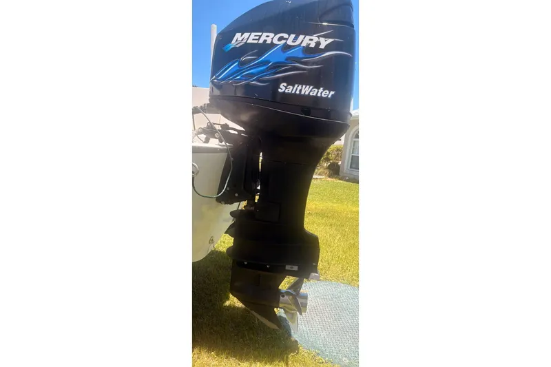 Slide: The Image of Mercury Saltwater outboard motor on a 1998 Boston Whaler 230 Outrage boat. - 2