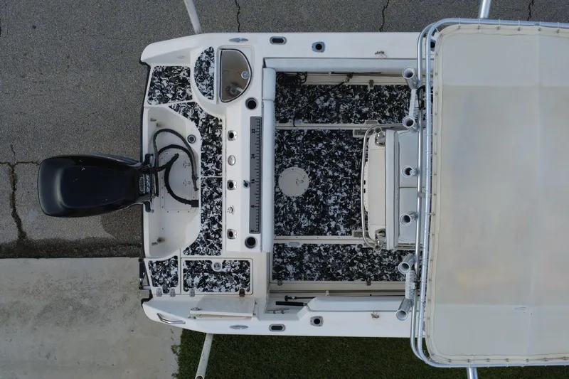 Slide: The Image of Overhead view of a 1998 Boston Whaler 230 Outrage boat with patterned deck. - 26