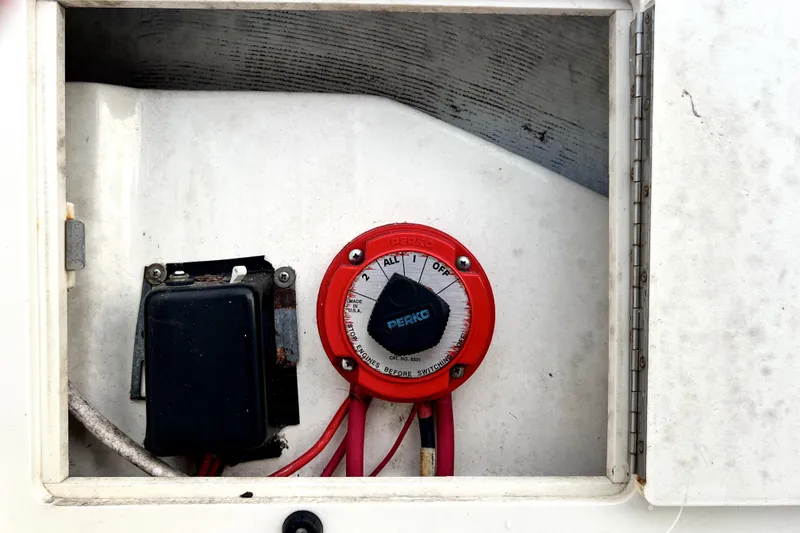 Slide: The Image of Battery switch and wiring inside a 1998 Boston Whaler 230 Outrage boat compartment. - 35
