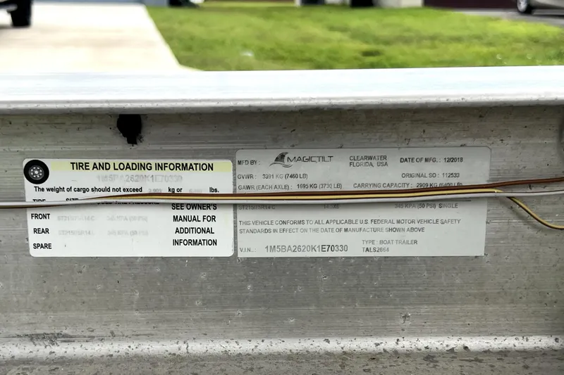 Slide: The Image of Tire and loading information label on a boat trailer, manufactured in December 2018. - 50