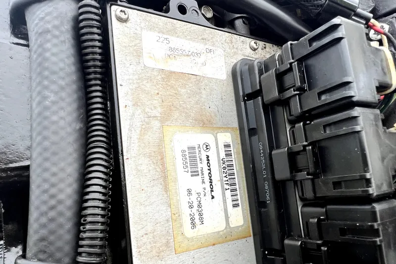 Slide: The Image of Close-up of a 1998 Boston Whaler 230 Outrage engine component with wiring and labels. - 52