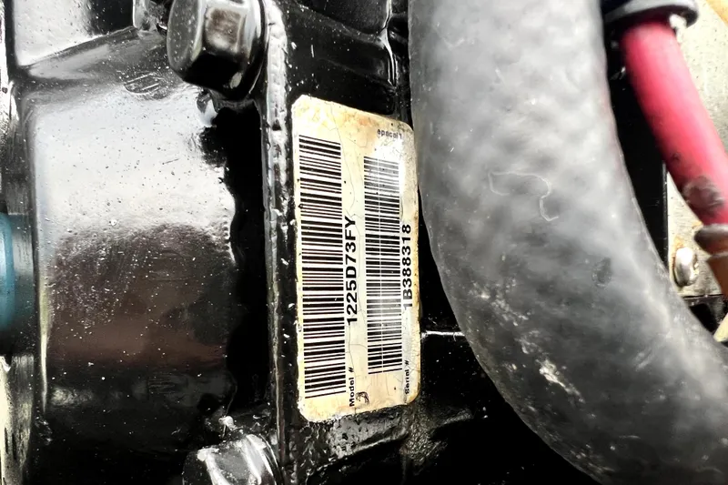 Slide: The Image of Close-up of a Boston Whaler 230 Outrage 1998 engine serial number label. - 53