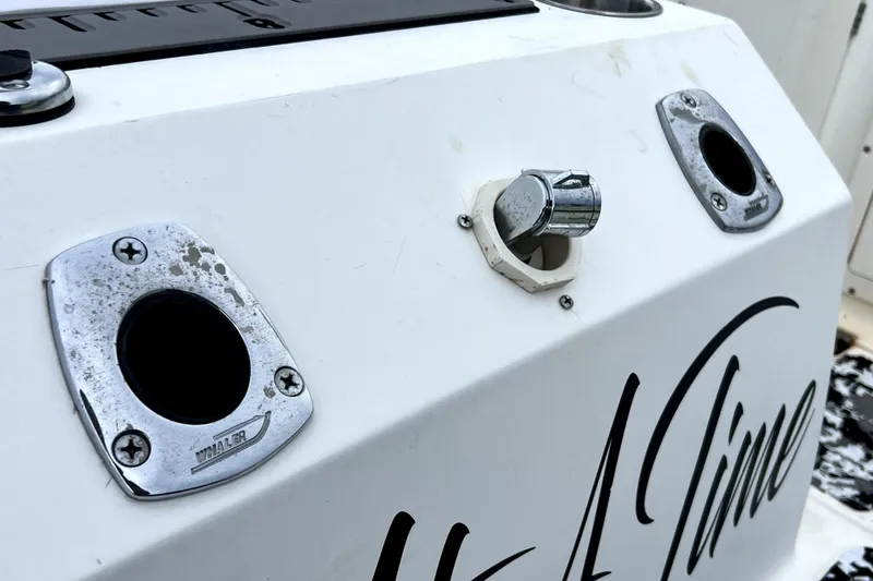 Slide: The Image of Close-up of a 1998 Boston Whaler 230 Outrage boat's chrome fittings and lettering. - 57