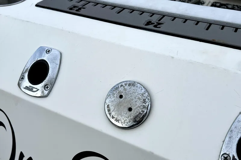 Slide: The Image of Close-up of 1998 Boston Whaler 230 Outrage boat fittings and measurement markings. - 59