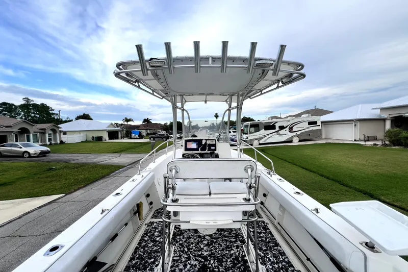 Slide: The Image of 1998 Boston Whaler 230 Outrage boat with T-top, parked in a residential neighborhood. - 60