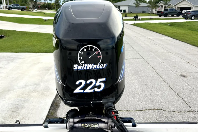 Slide: The Image of Outboard motor on a 1998 Boston Whaler 230 Outrage, labeled "SaltWater 225." - 64