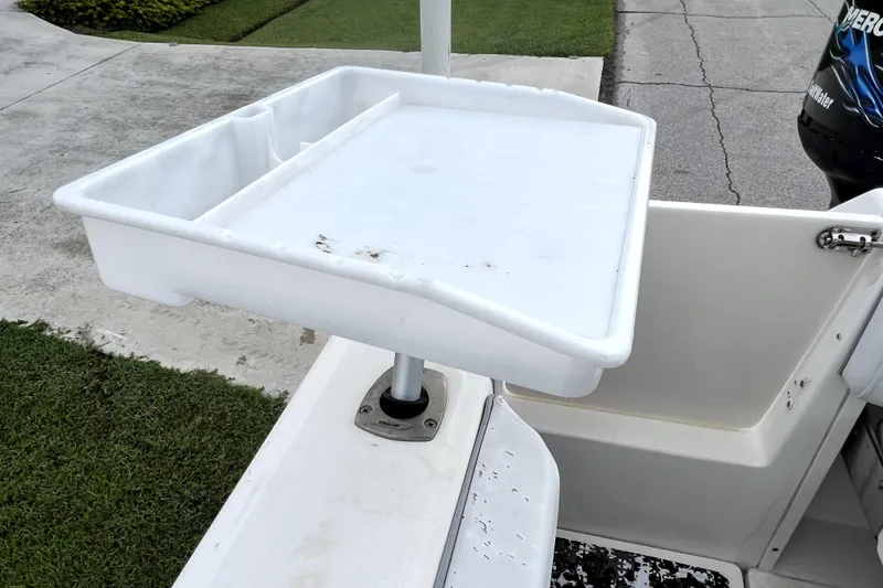 Slide: The Image of Cutting board on a 1998 Boston Whaler 230 Outrage boat, docked on concrete. - 66