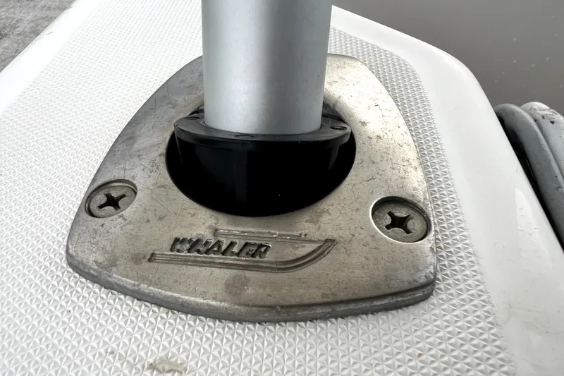 Slide: The Image of Close-up of a 1998 Boston Whaler 230 Outrage boat fitting with logo. - 67