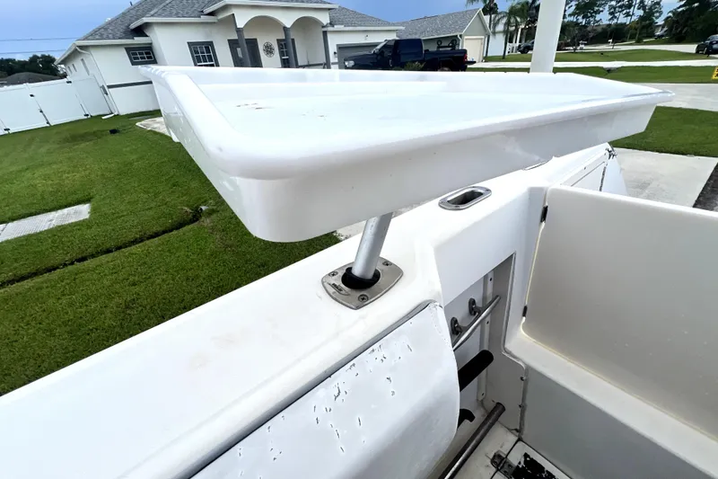 Slide: The Image of 1998 Boston Whaler 230 Outrage boat detail with white deck and seating. - 68