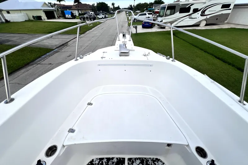 Slide: The Image of 1998 Boston Whaler 230 Outrage boat deck, parked in residential area. - 70