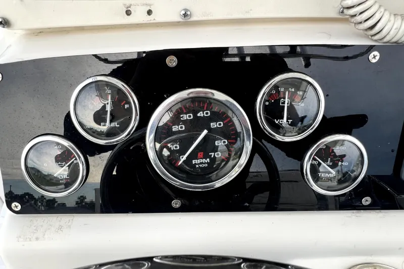 Slide: The Image of Dashboard gauges of a 1998 Boston Whaler 230 Outrage boat. - 78