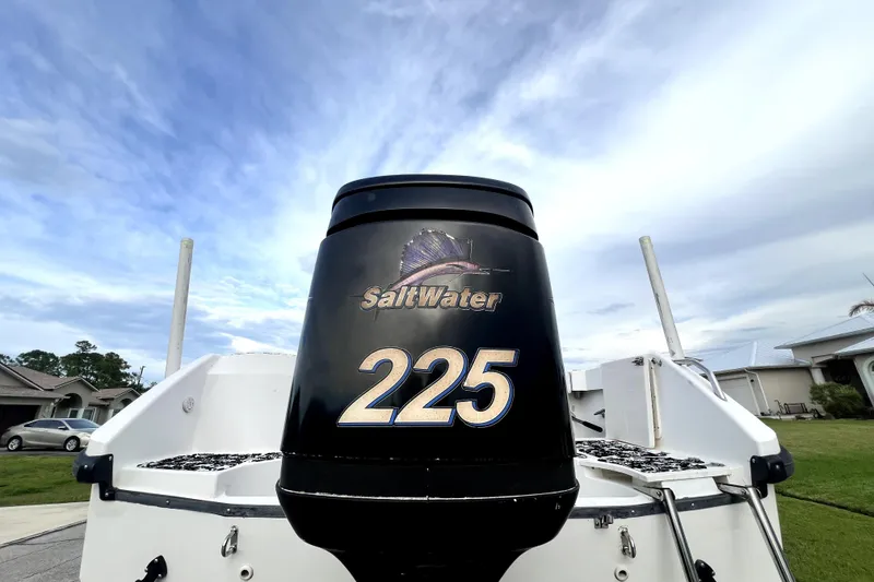 Slide: The Image of Outboard motor on a 1998 Boston Whaler 230 Outrage, labeled "SaltWater 225." - 8