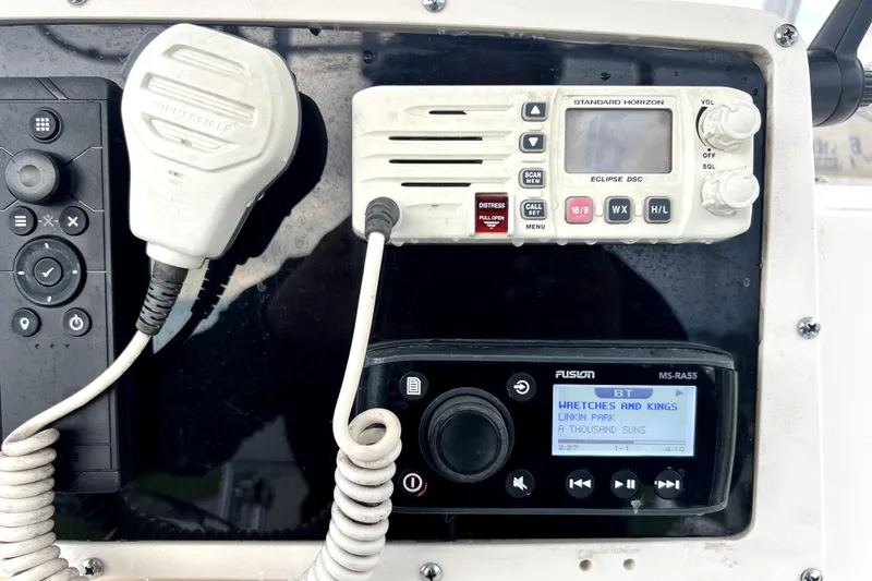 Slide: The Image of Control panel of a 1998 Boston Whaler 230 Outrage with radio and audio system. - 84