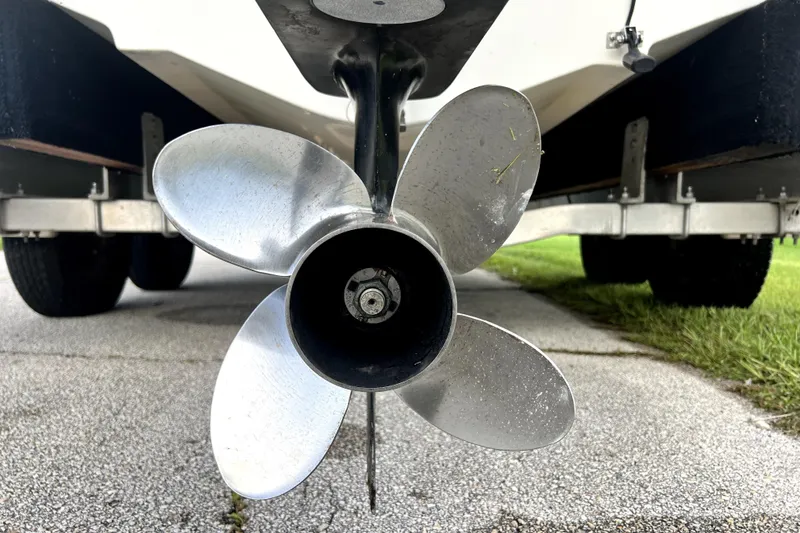 Slide: The Image of Propeller of a 1998 Boston Whaler 230 Outrage boat on a trailer. - 9