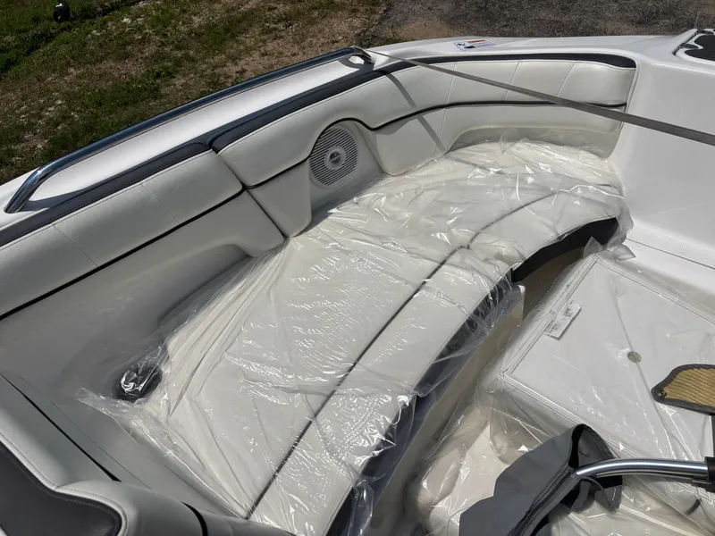 Slide: The Image of The 2014 Yamaha AR210 features cushioned seating with a speaker and storage area. - 10