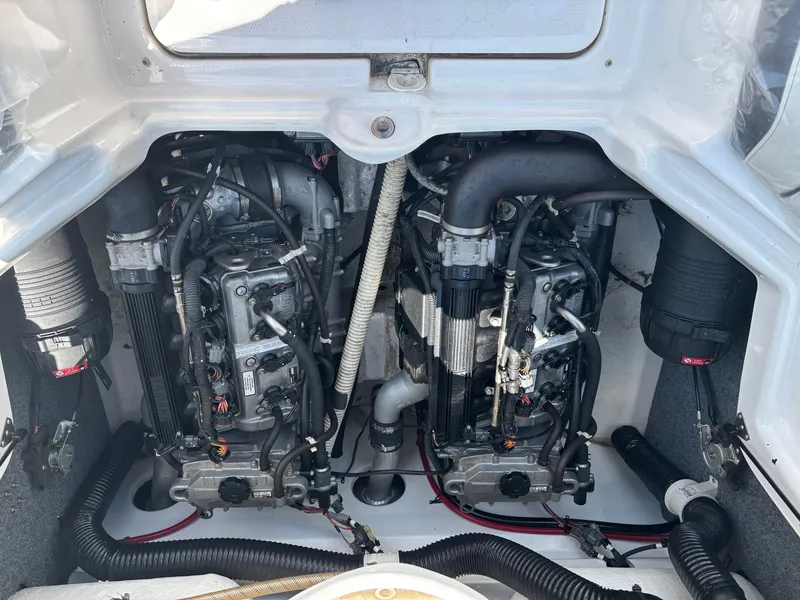 Slide: The Image of Two engines inside a boat, surrounded by hoses and cables. - 9