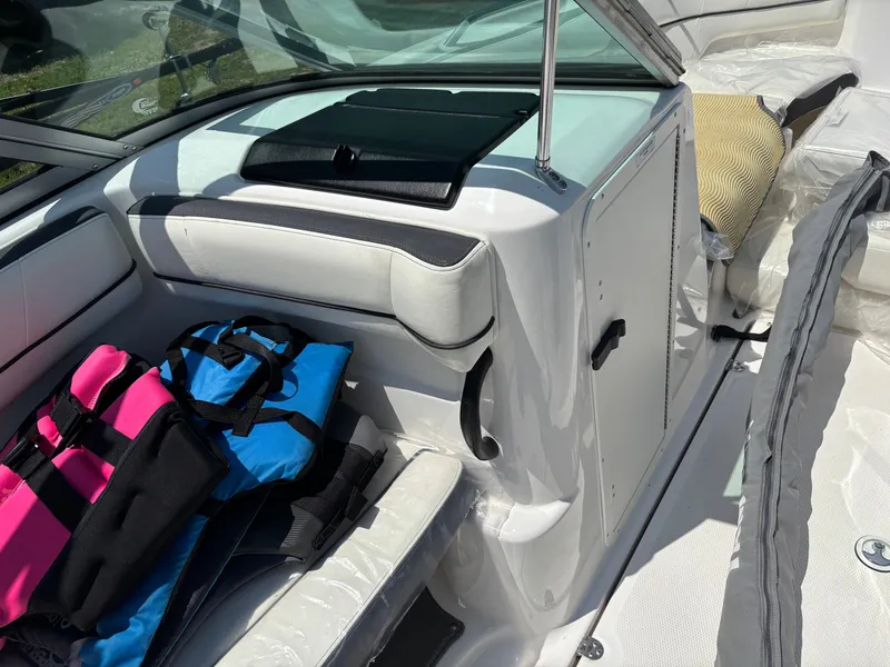 Slide: The Image of Interior of a 2014 Yamaha AR210 boat with seating and life jackets. - 3
