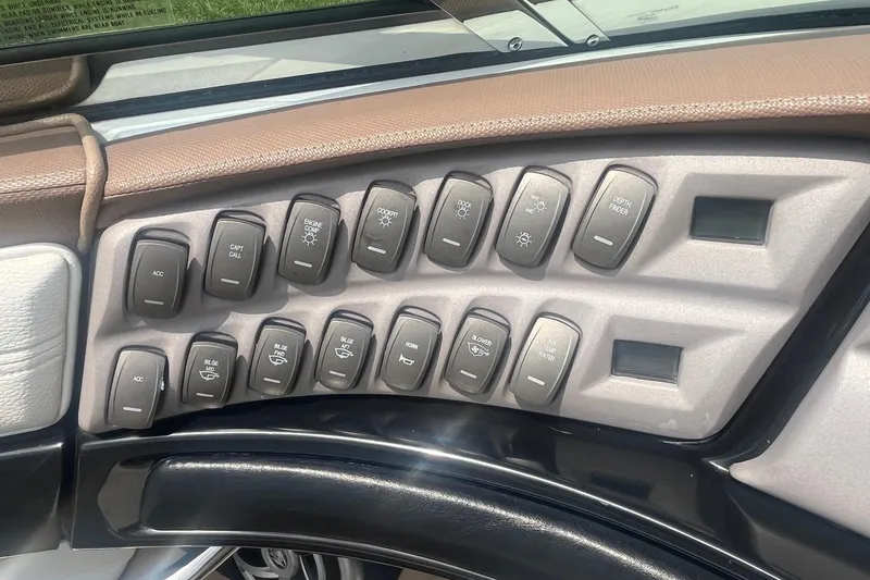 Slide: The Image of Control panel of a 2007 Cobalt 343 boat with labeled switches and buttons. - 14