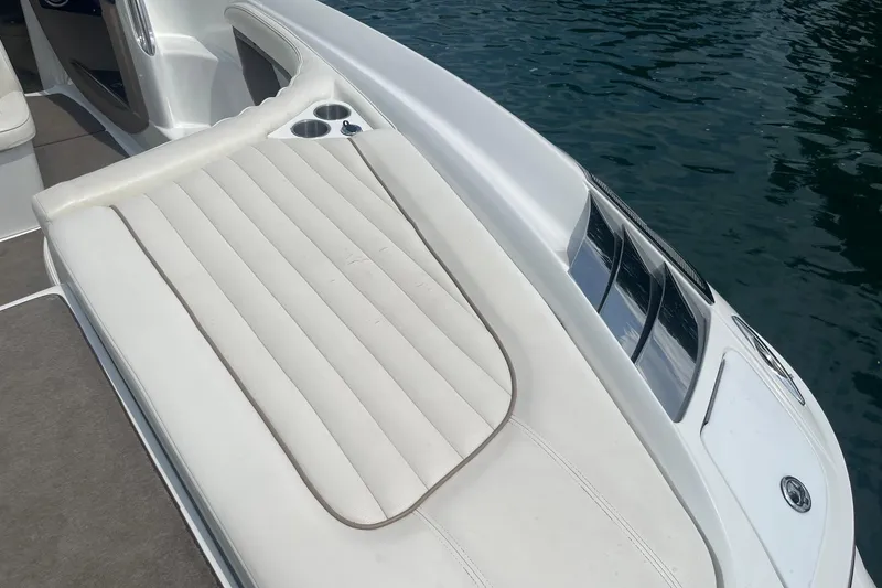 Slide: The Image of Luxury seating on a 2007 Cobalt 343 boat, featuring white upholstery and cup holders. - 10