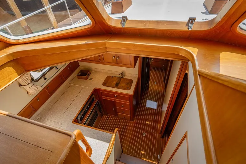 Slide: The Image of Galley down with entrance to owners berth straight ahead and guest stateroom to stbd - 11