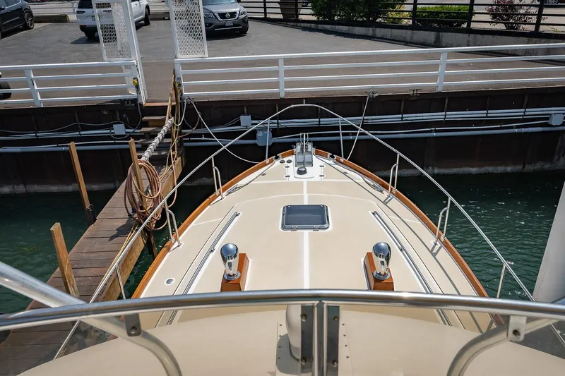 Slide: The Image of Bow view of 2004 Grand Banks 43 Eastbay FB yacht docked at marina. - 27