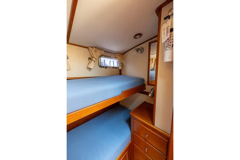 Slide: The Image of Guest stateroom to port with upper and lower berths and plenty of storage - 15