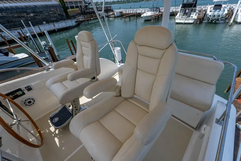 Slide: The Image of Helm and companion seat plus more seating with storage under. - 26