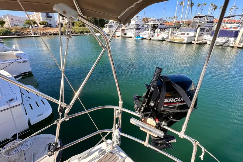 Slide: The Image of Jeanneau Sun Odyssey 379 sailboat with Mercury outboard motor in a marina, 2015 model. - 15