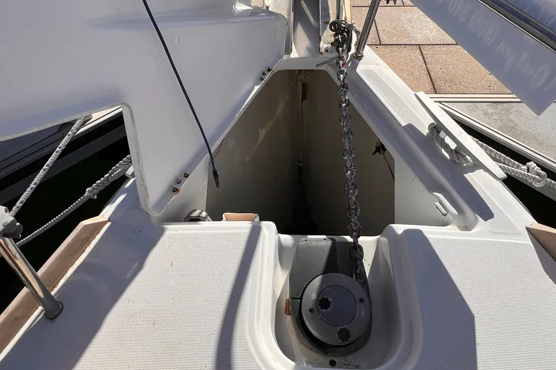 Slide: The Image of Anchor locker of 2015 Jeanneau Sun Odyssey 379 sailboat with chain and winch. - 20
