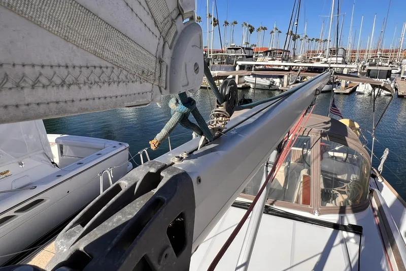 Slide: The Image of Jeanneau Sun Odyssey 379 sailboat, 2015 model, docked in a marina with clear blue skies. - 25