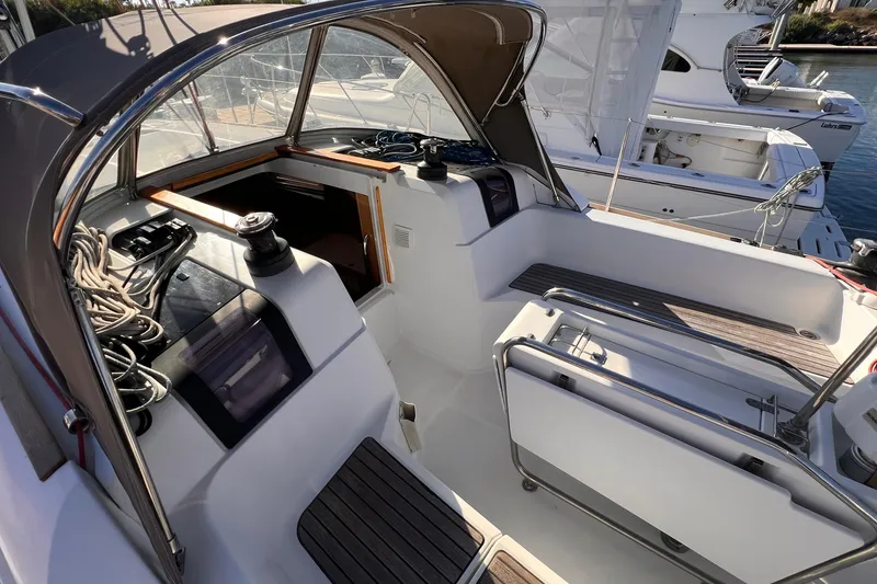 Slide: The Image of Cockpit of 2015 Jeanneau Sun Odyssey 379 sailboat, featuring winches and seating. - 30