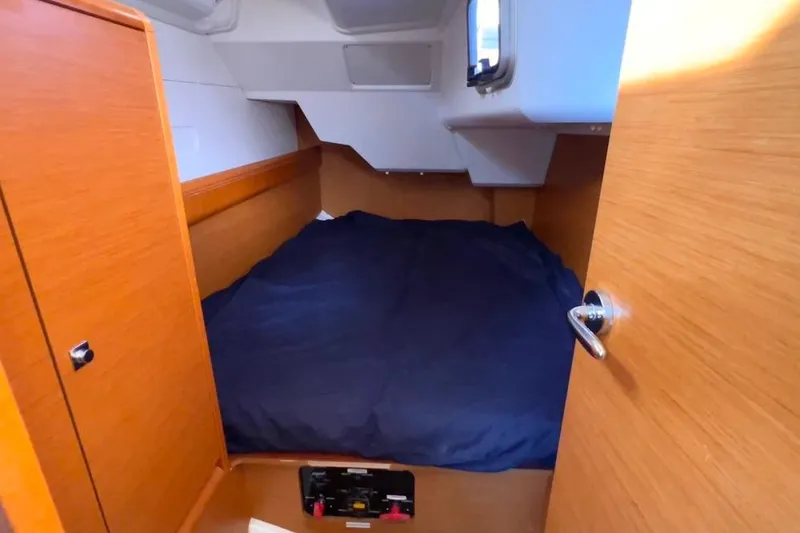 Slide: The Image of Cabin interior of 2015 Jeanneau Sun Odyssey 379 sailboat with wooden finish. - 34