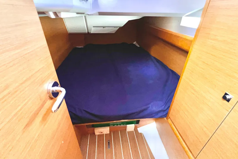 Slide: The Image of Cozy cabin interior of 2015 Jeanneau Sun Odyssey 379 sailboat with wooden finish. - 35
