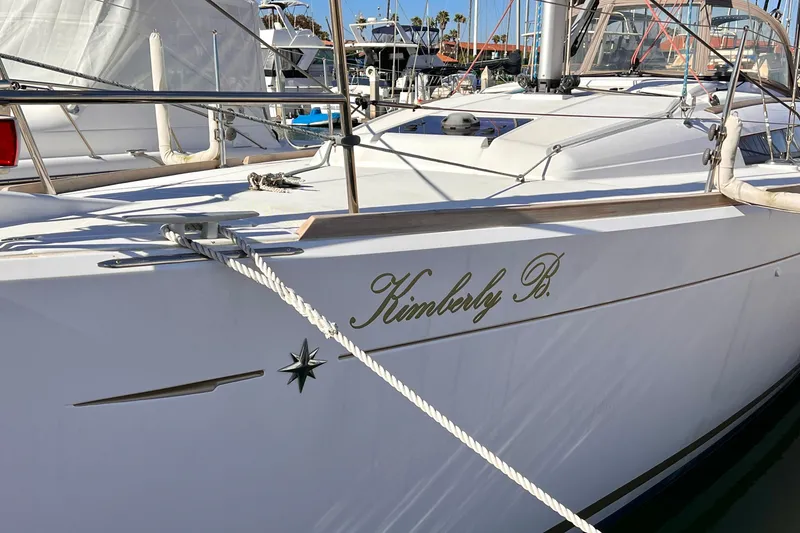 Slide: The Image of Jeanneau Sun Odyssey 379 sailboat, 2015 model, docked with "Kimberly B." name visible. - 4