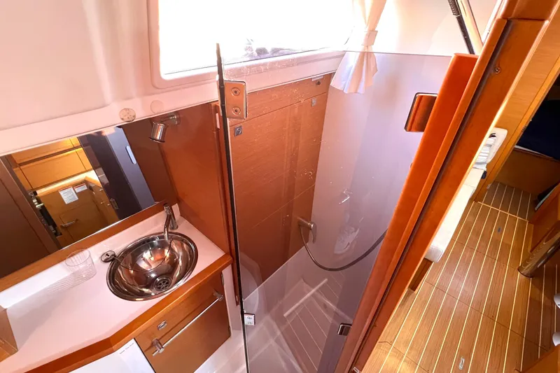 Slide: The Image of Interior of 2015 Jeanneau Sun Odyssey 379 yacht bathroom with sink and shower. - 40