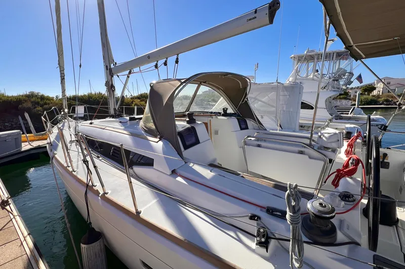 Slide: The Image of 2015 Jeanneau Sun Odyssey 379 sailboat docked in marina under clear blue sky. - 9