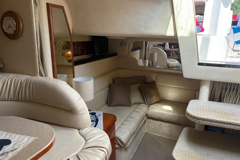 Slide: The Image of Luxurious interior of a 2001 Sea Ray 340 Sundancer yacht with plush seating. - 25