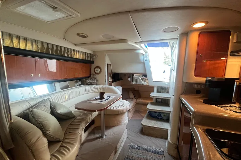 Slide: The Image of Luxurious interior of a 2001 Sea Ray 340 Sundancer yacht with elegant seating and cabinetry. - 22