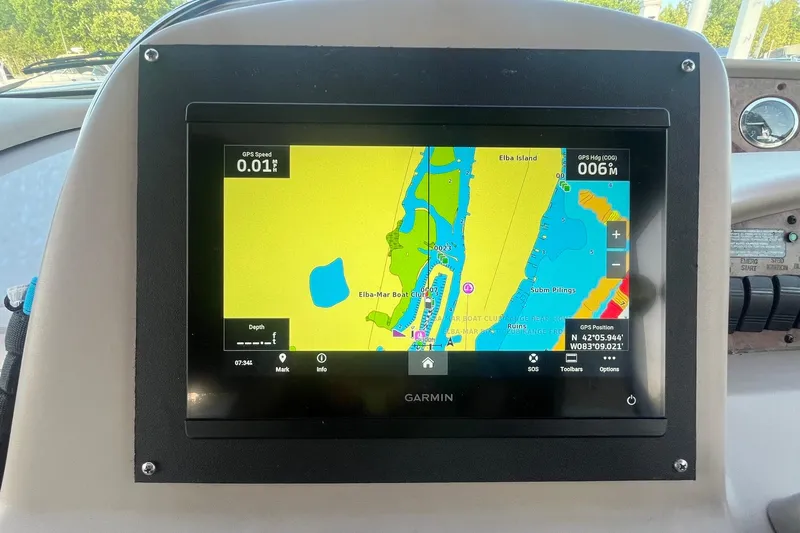 Slide: The Image of Garmin GPS display on 2001 Sea Ray 340 Sundancer showing navigation map and coordinates. - 13