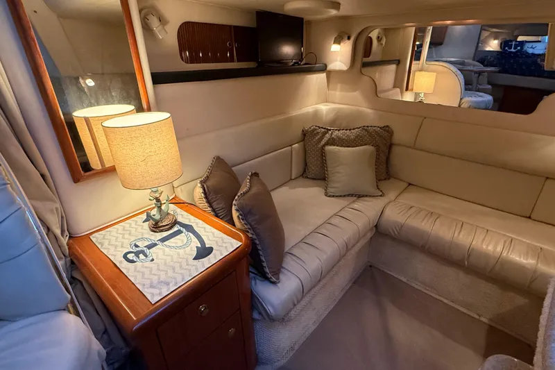 Slide: The Image of Luxurious interior of 2001 Sea Ray 340 Sundancer yacht with cozy seating and elegant decor. - 29