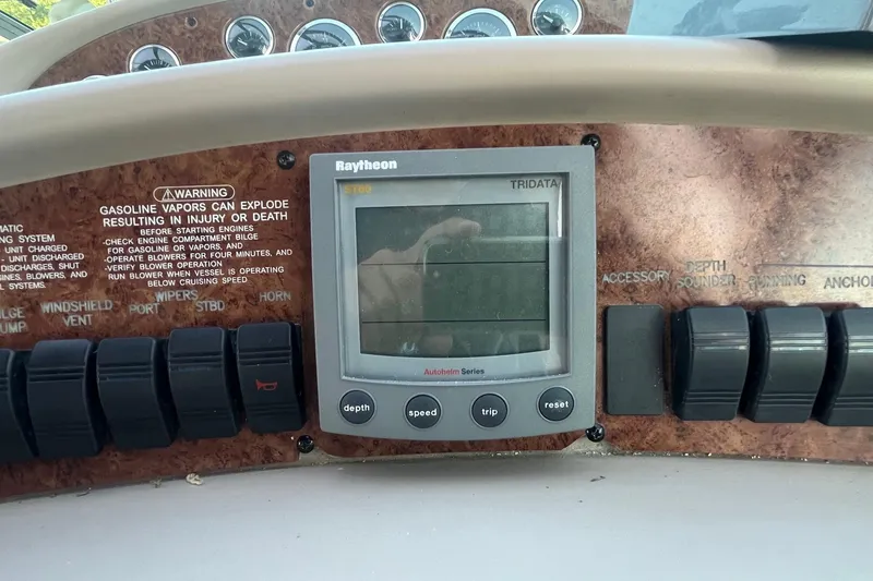 Slide: The Image of Control panel of a 2001 Sea Ray 340 Sundancer boat with Raytheon display. - 15
