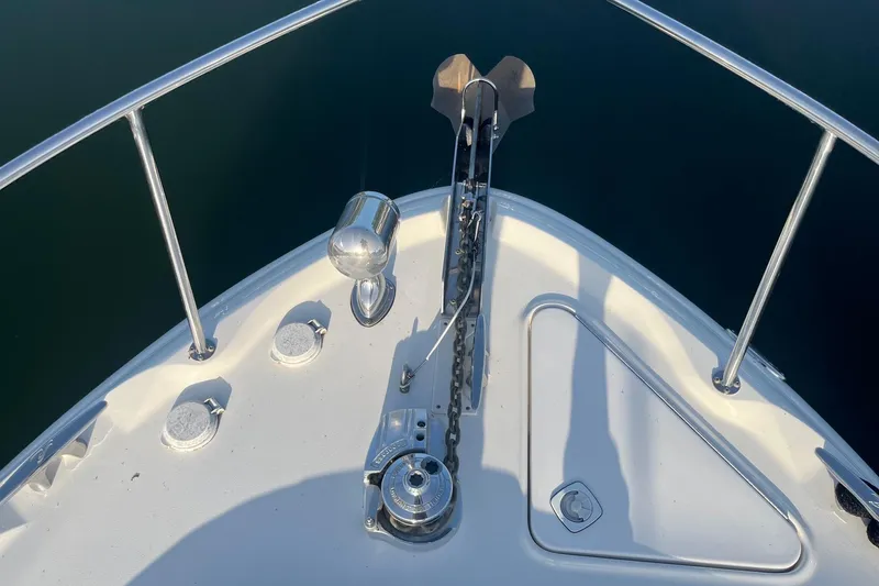 Slide: The Image of Bow of 2001 Sea Ray 340 Sundancer with anchor and railing. - 5